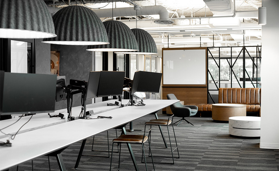 Digney York Associates collaboration area with long tables and monitors