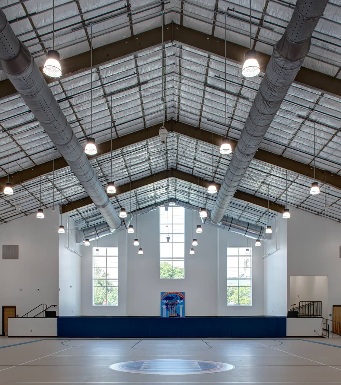 Inside view of a large gymnasium with open bright light