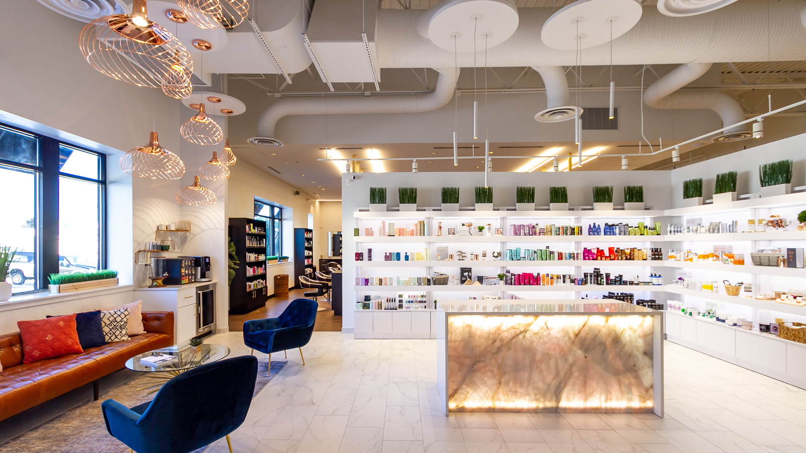 Inside view of a beautity parlor with seats and shelves of products