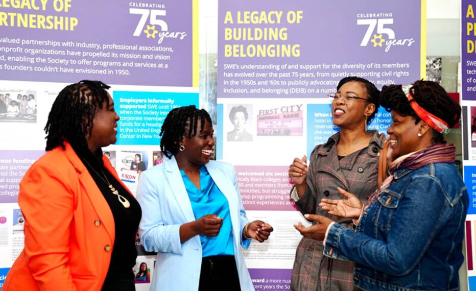 Group of women laughing with one another at the SWE 75th anniversary