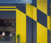 Checkerspot Brewery exterior from side with open garage door