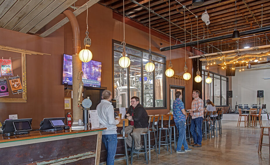 Checkerspot Brewery interior of people talking along bar