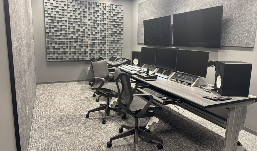 Leidos Annex broadcast studio with table and chairs and textured walls