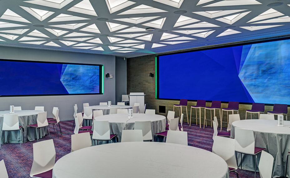 Leidos conference room with table and chairs and screens