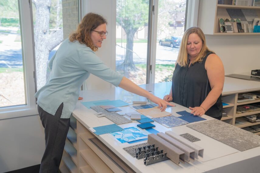 Designers reviewing building materials on a table