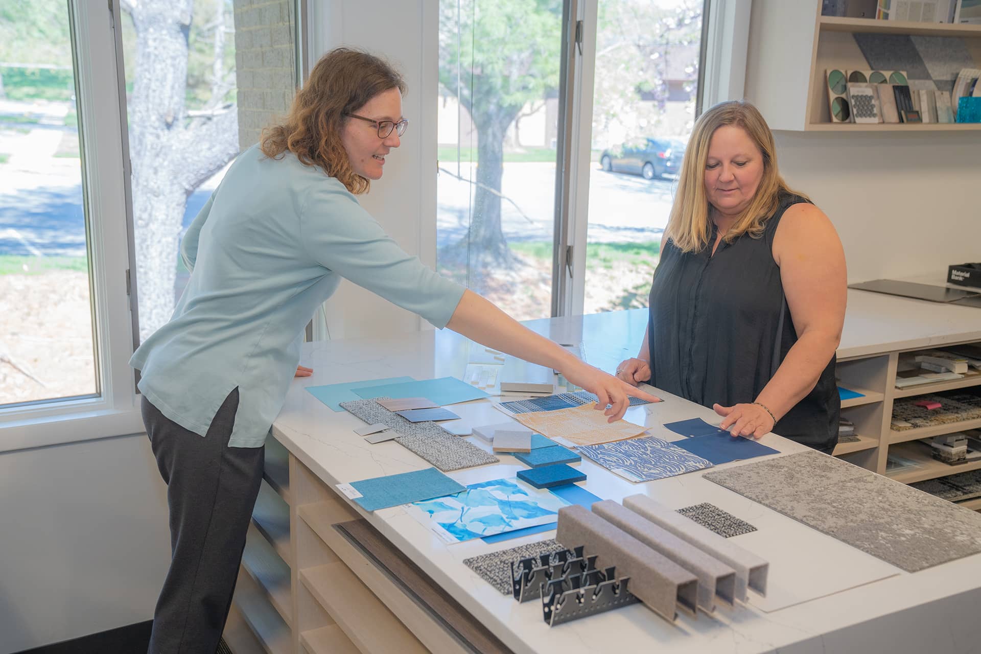 Designers reviewing building materials on a table