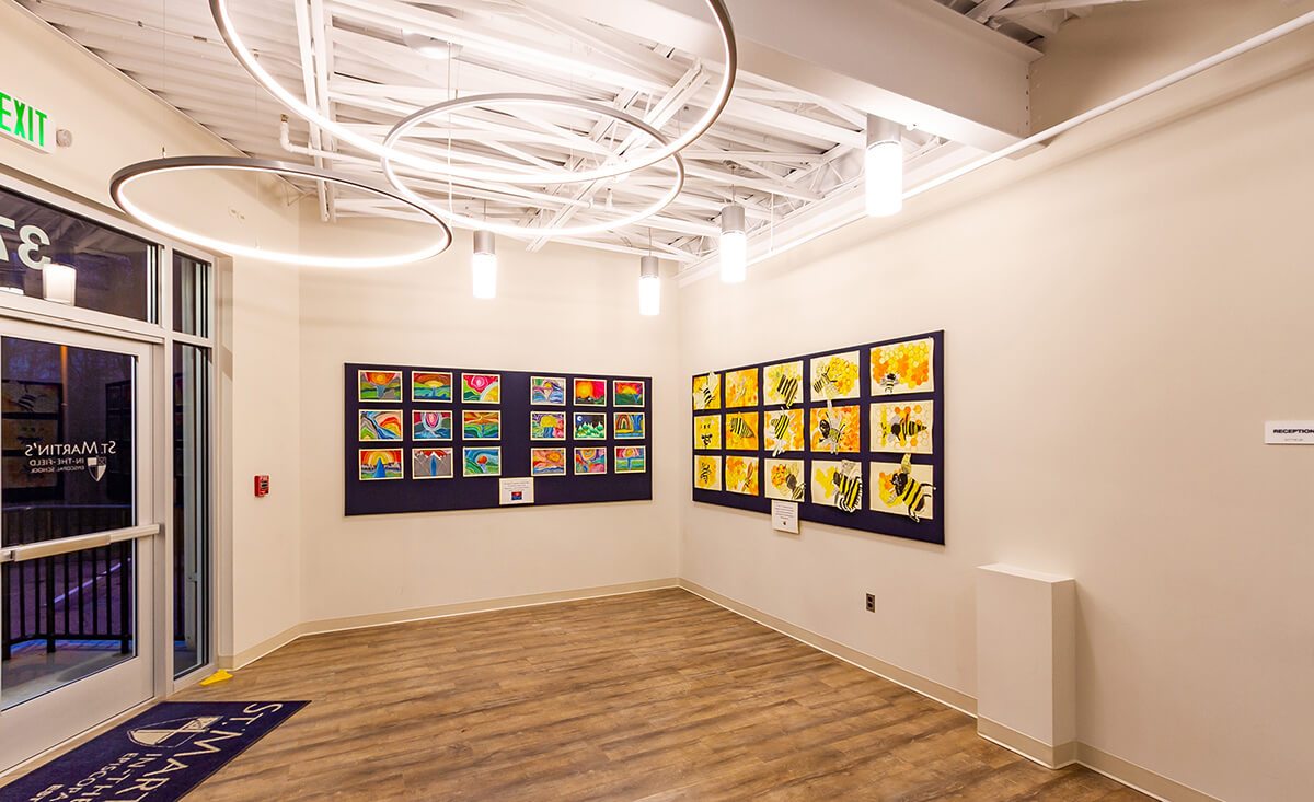 St. Martins Episcopal School interior of gallery featuring artwork and large LED lights