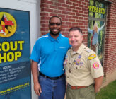 BSA Scout Shop exterior with two people posing