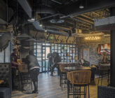 Kudu Dynamics office interior photo of cafe tables and shelving