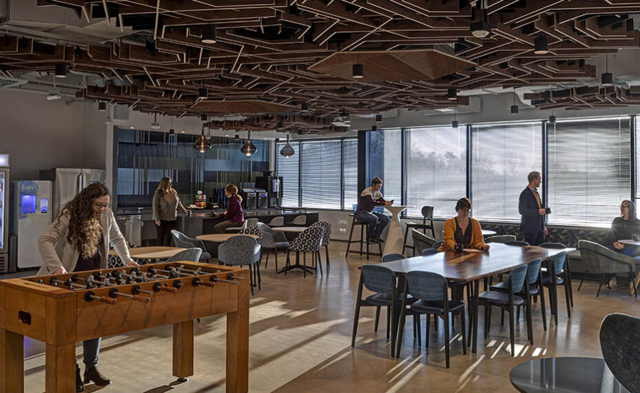 Global Technology Company interior breakroom with people at tables talking