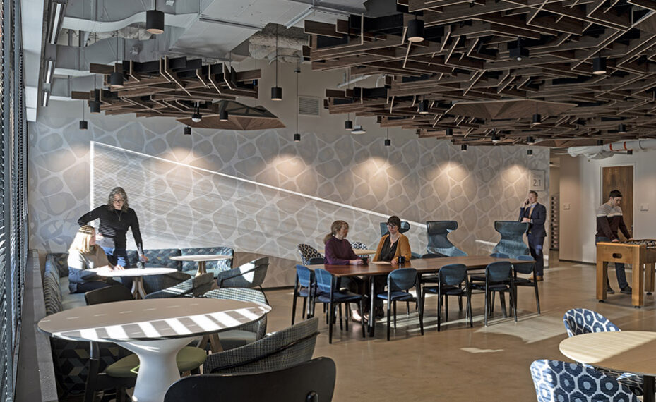 Global Technology Company interior breakroom with people at tables talking