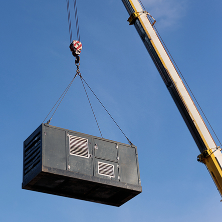 Industrial crane lifting HVAC equipment square image